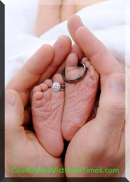 Love this picture of a newborn with the Dad's and Mom's hands to either side and their rings placed on the toes of the wee one. A true symbol of their love.